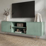 Green TV entertainment unit with vertical ribbing and silver metal legs for a modern, colorful living room.