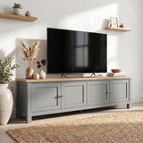 [Grey] 180cm Shaker TV Unit with Storage three-quarter view in styled living room with oak top, four shaker doors, brushed nickel knobs and pampas grass decor