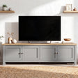 [Grey] 180cm Shaker TV Unit with Storage front view showing four shaker doors with brushed nickel knobs, oak top and floating shelves on white wall behind