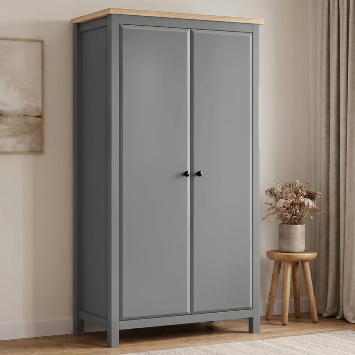 [Grey] Haven Grey 2 Door Double Wardrobe with Shelves and Hanging Rail closed angled view highlighting its wooden top.