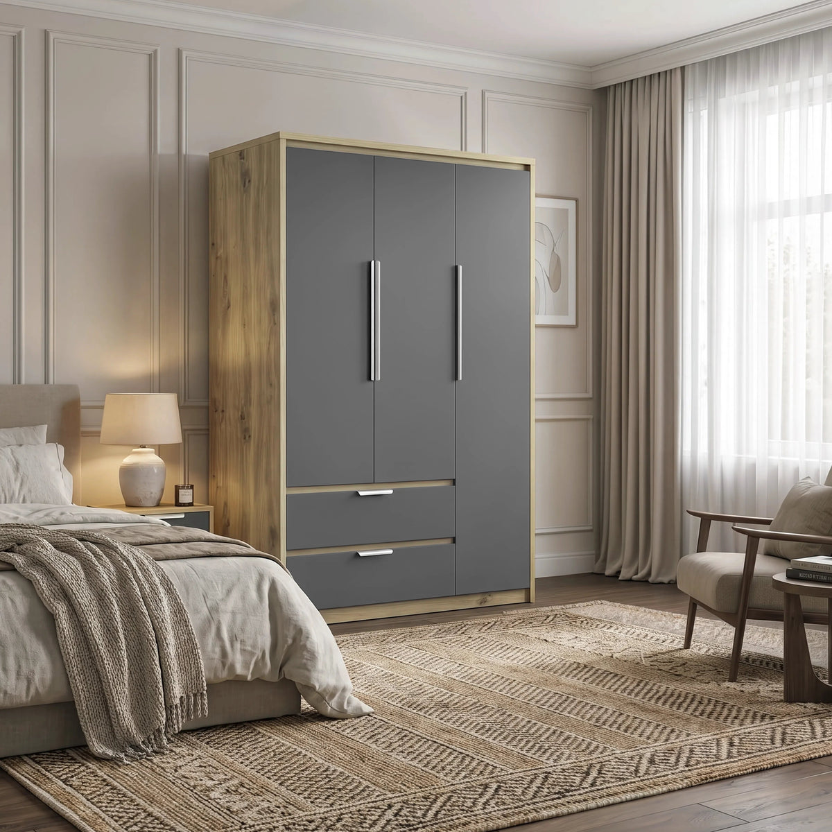 [Grey] A modern bedroom scene featuring a tall gray three-door wardrobe with two long black handles and a lower drawer, set against cream walls next to a bed and a small wooden side table.