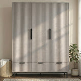 [Grey] three door wardrobe with drawers styled in modern room with neutral walls and lighting
