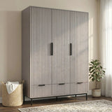 [Grey] three door wardrobe with drawers styled in modern room with neutral walls and lighting