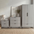 [Grey] Matching furniture set containing a wardrobe, drawers for the bedroom, and a bedside table in a natural light room