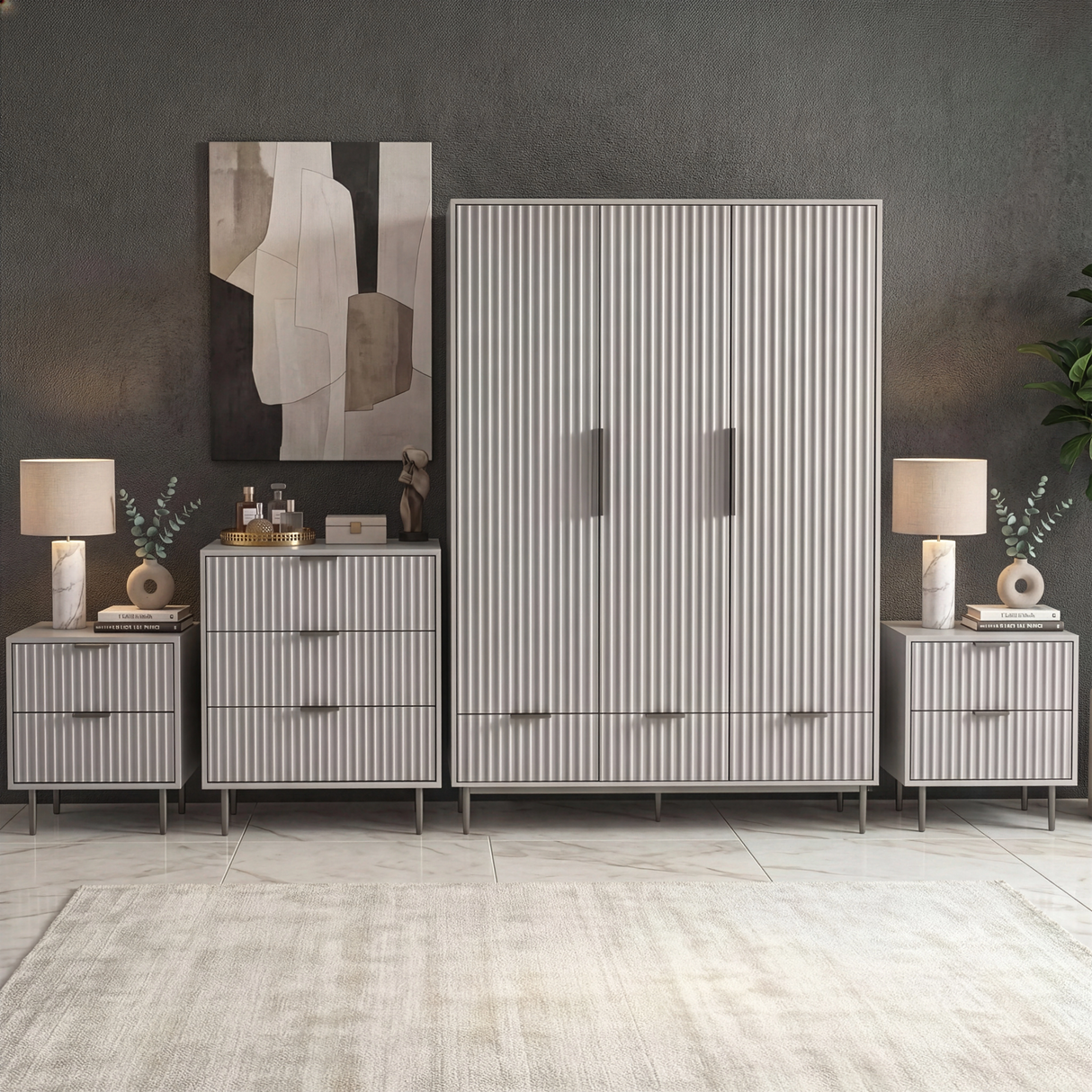 Grey four piece bedroom furniture set with a wardrobe, chest of drawers, and two bedside cabinets