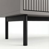 [Grey] Lower section of grey 5 chest of drawers with black metal legs and corner of the cabinet base