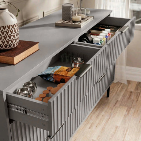 [Grey] bedroom drawers fully opened to reveal internal compartments and storage capacity