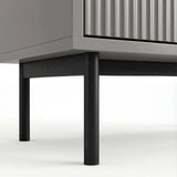 Grey 6 drawer wide and deep chest elevated on slim black metal legs with a stable base structure