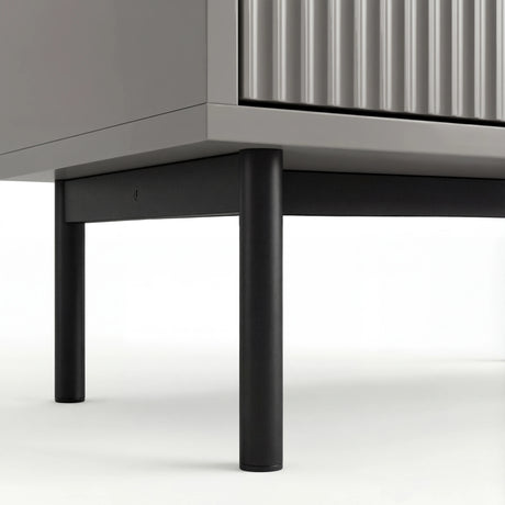 Grey 6 drawer wide and deep chest elevated on slim black metal legs with a stable base structure