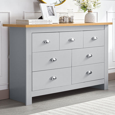 Grey 7-drawer dresser with chrome handles and wooden top, perfect for modern home storage.