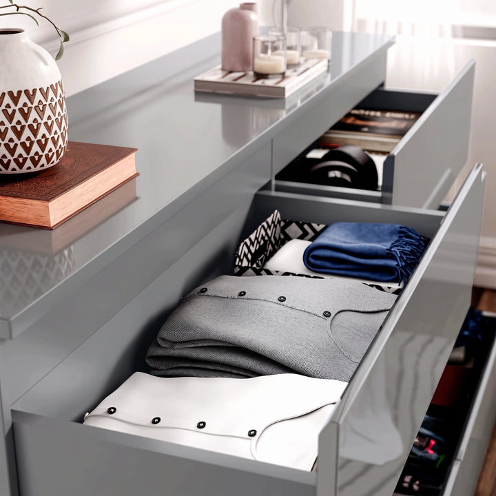 [Grey] high gloss wide chest of drawers grey top drawers open with folded shirt and accessories