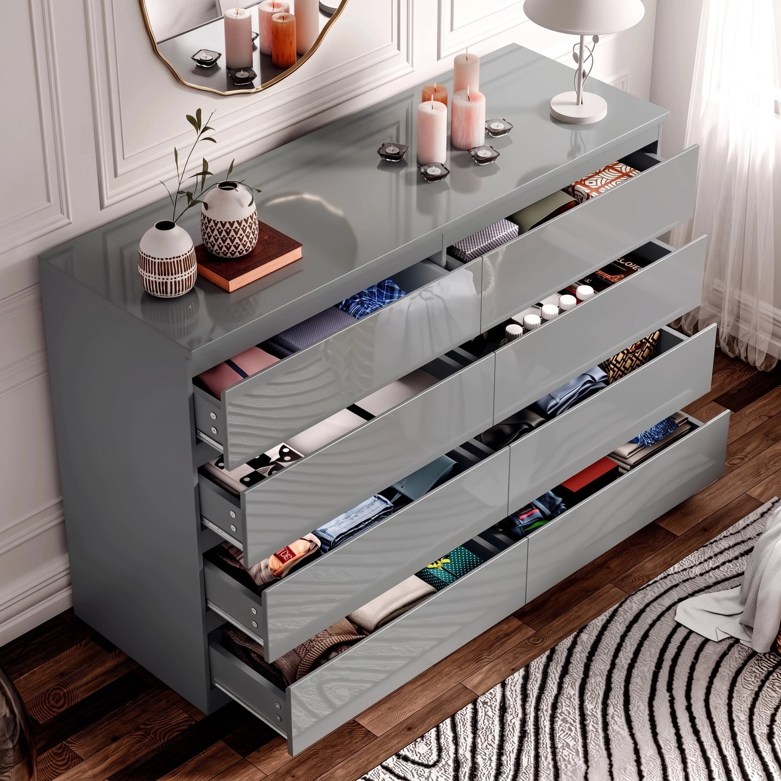 [Grey] high gloss wide chest of drawers with all eight drawers open displaying folded clothes inside