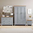 Grey bedroom furniture set with chest of drawers and bedside table, stylish and practical.
