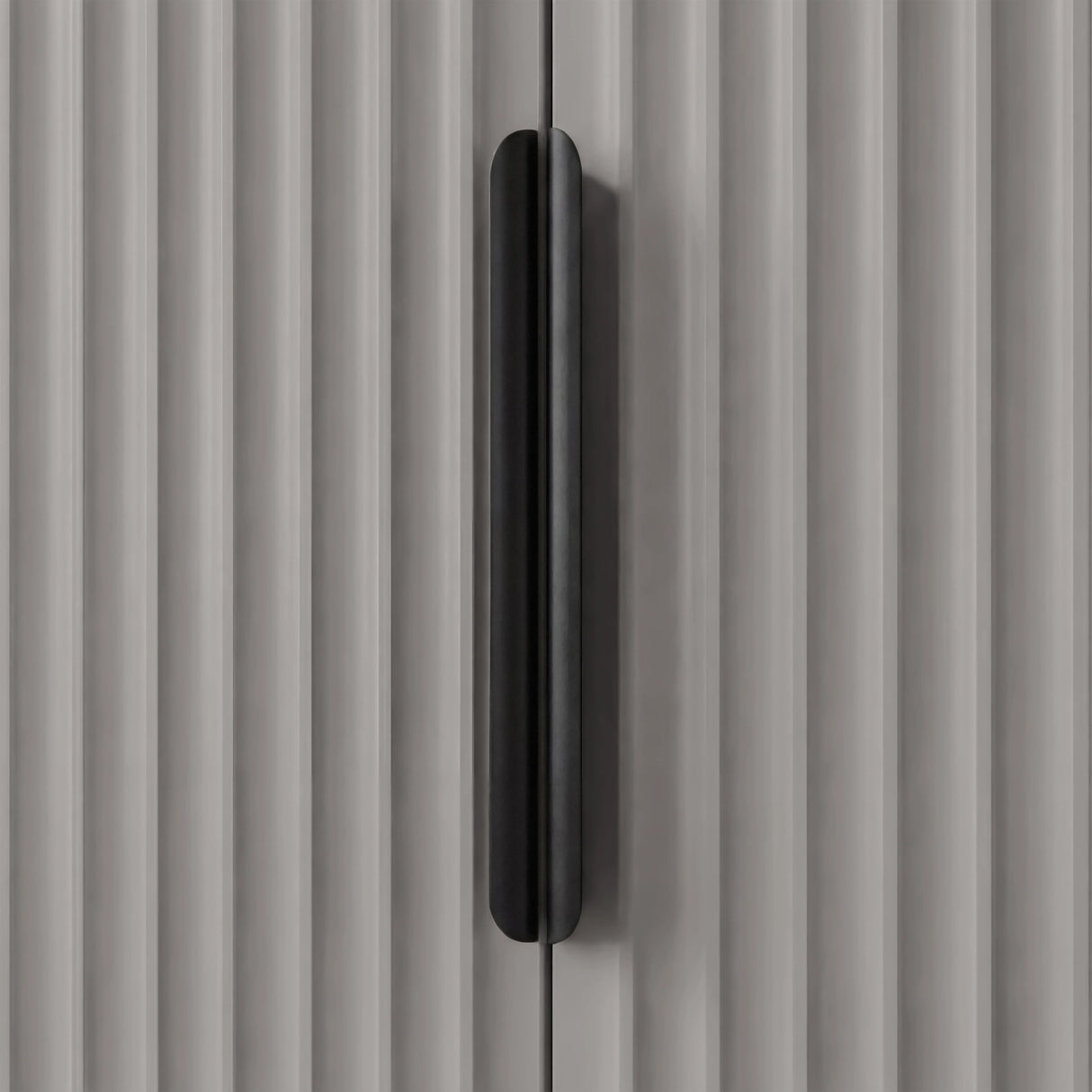 Grey wardrobe handle detail with vertical metal grip mounted on textured panel