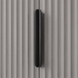 Grey wardrobe handle detail with vertical metal grip mounted on textured panel