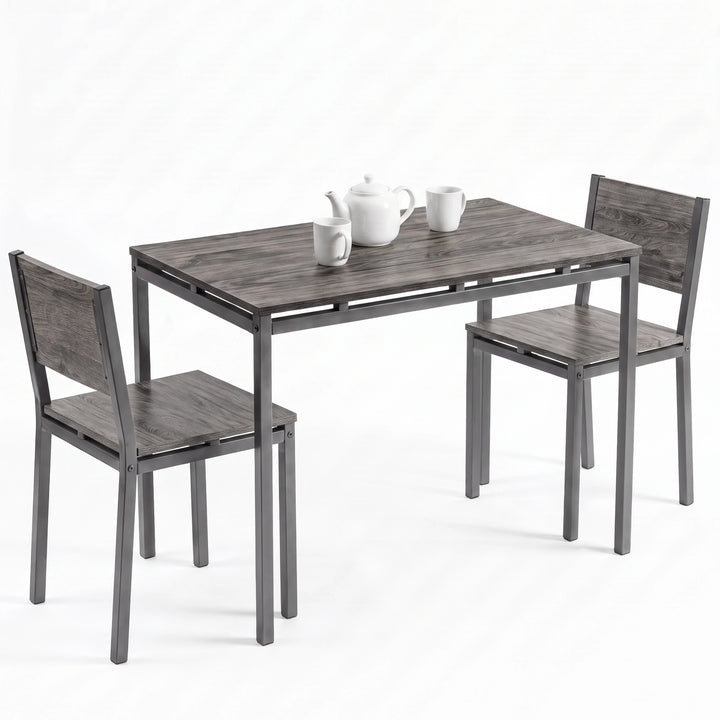[Grey] Breakfast table set of 2 with grey wood-effect top, two chairs, teapot and mugs on a white background.