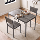 [Grey] high-angle view of breakfast table and chairs for 2 with cereal bowls, coffee mugs and placemats in a bright kitchen.