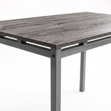 [Grey] Close-up of grey wood-effect breakfast tabletop, spray-painted metal frame, raised supports, square legs & corner bolt