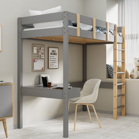 Grey bunk bed with desk, patterned bedding, and ladder, perfect for kids' rooms.