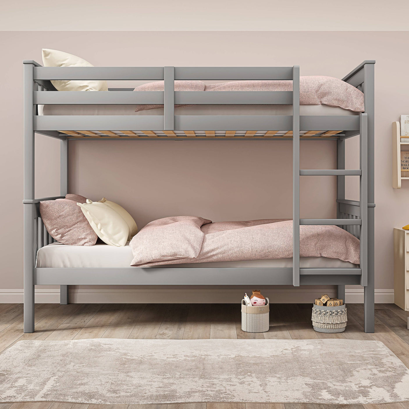 Front view of grey double bunk bed for kids with pink bedding, showcasing a sturdy wooden frame and safety rails.