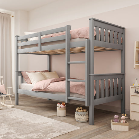 Grey bunk beds with stairs and quilt, offering a functional and stylish sleeping solution.
