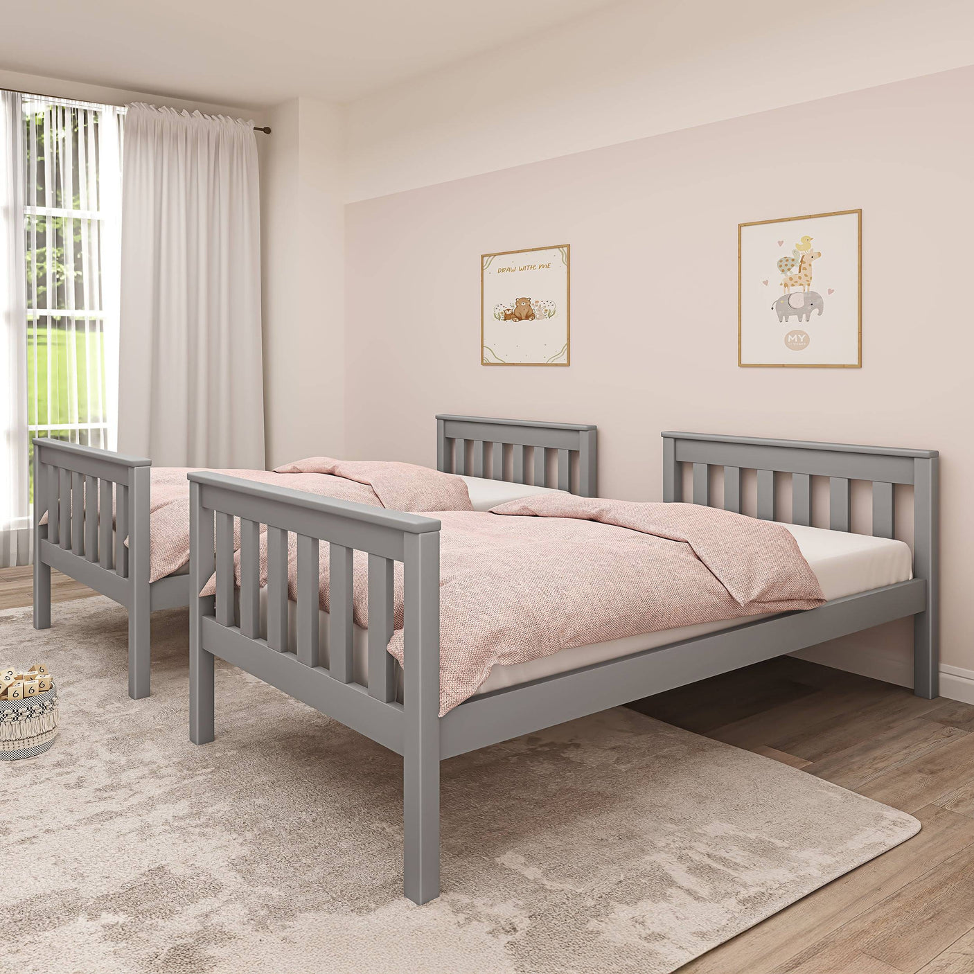 Grey detachable bunk bed shown as two single beds with pink bedding, offering flexible sleeping solutions for kids.