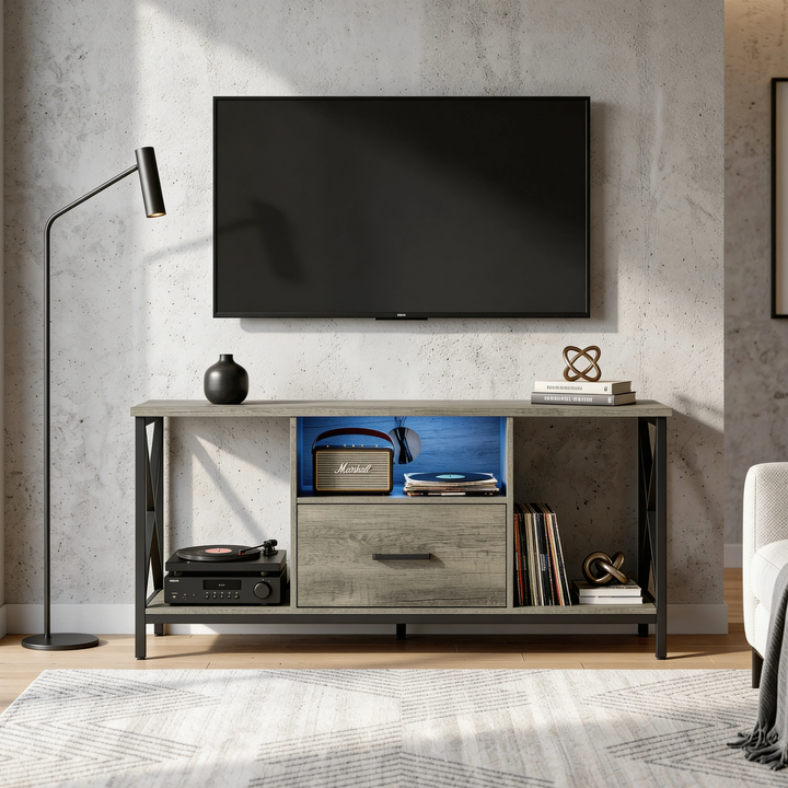 [Grey] Calvera grey TV stand against concrete wall with Marshall speaker, vinyl record player and floor lamp left