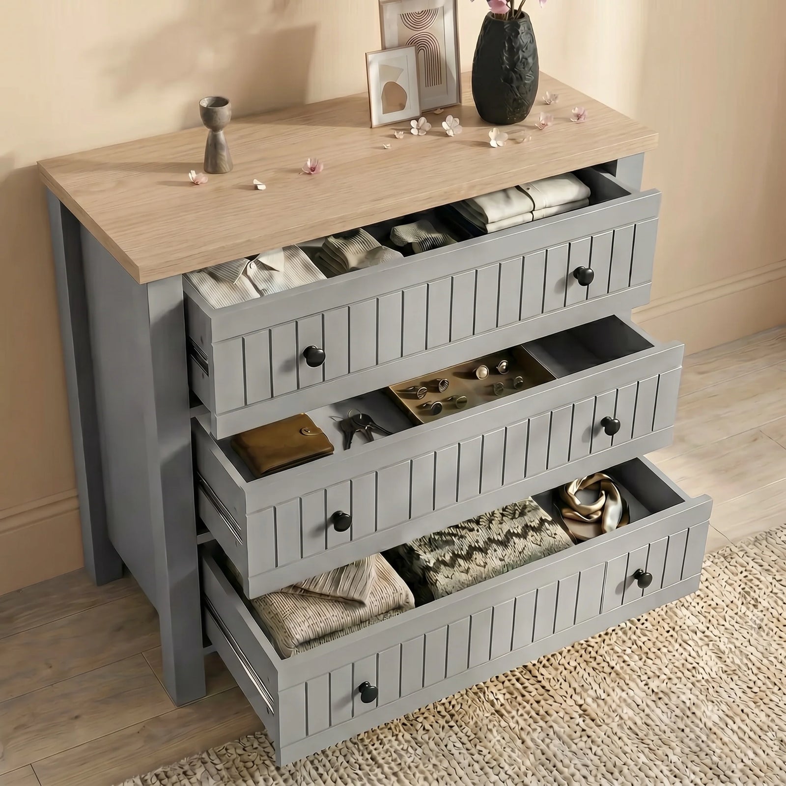 [Grey] Linra Painted 4 Piece Bedroom Furniture Set Grey with the chest drawers extended to show personal item