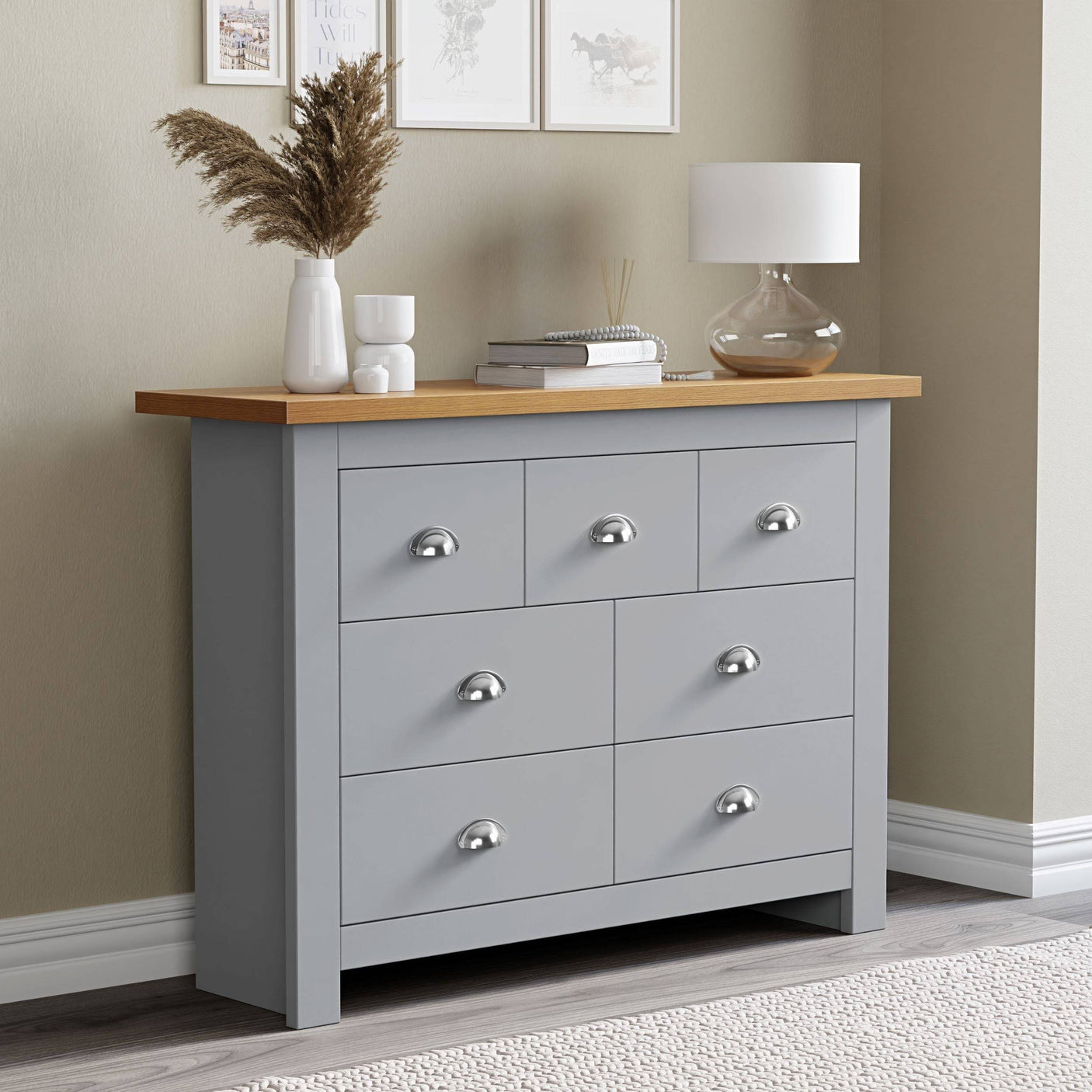 Grey chest of drawers with oak top surface, perfect for flower pot display and additional storage.
