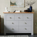 7 drawer wide chest of drawers with a light wood top and matte grey finish, ideal large bedroom dresser for clothes and accessory storage.