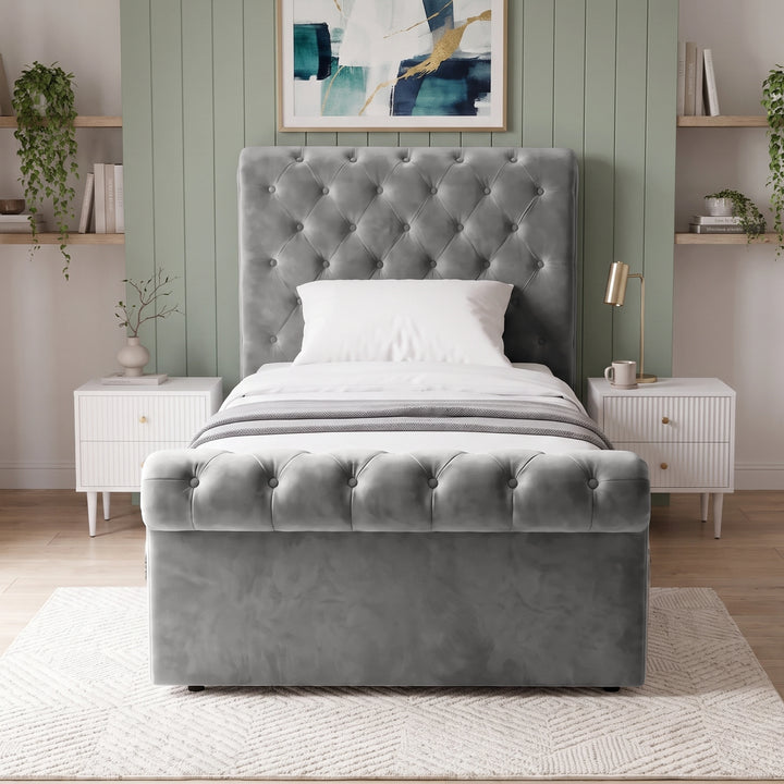 [Single | Grey] Front view of the Chesterfield Single Ottoman Storage Bed Frame Grey Velvet showing the button-tufted footboard.