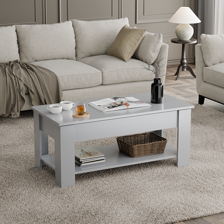 Grey coffee table with lift top and storage shelf for modern living room decor.