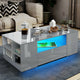 Modern grey coffee table with LED lighting and storage shelves for living room decor