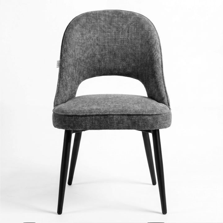 [Grey | Set of 4] Front view of comfy fabric dining chair with rounded open back, padded piped seat and black metal legs.