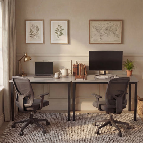 [120 X 50 cm] Computer Desk arranged as dual workstation in a beige room with botanical art, world map, mesh chairs, laptop, and curved monitor