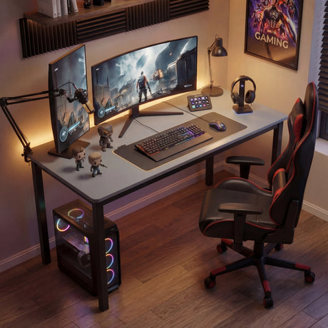 [120 X 50 cm] Computer Desk arranged as gaming room with dual monitors, mechanical keyboard, RGB PC tower, racing chair, and movie poster on the wal