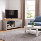 [Grey] A living room scene showing a blue sofa, white coffee table, grey rug, and a grey TV stand with a television, set in a bright room with beige curtains and wood flooring.