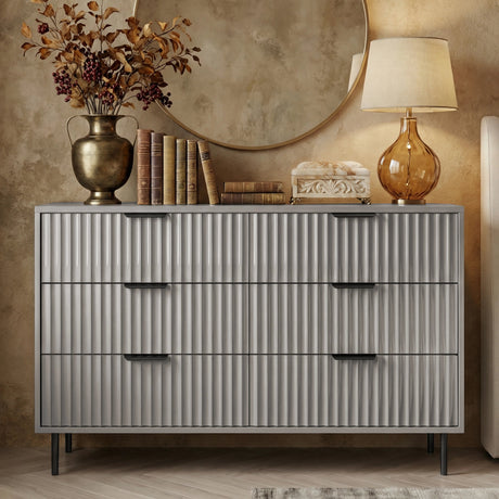 Front view of grey 6 drawer wide chest with vertical panel detailing and black metal handles