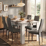 [6 Seater | Grey] Dining Table and Chairs Set with six grey padded chairs around a white table in a bright open-plan dining room with garden view