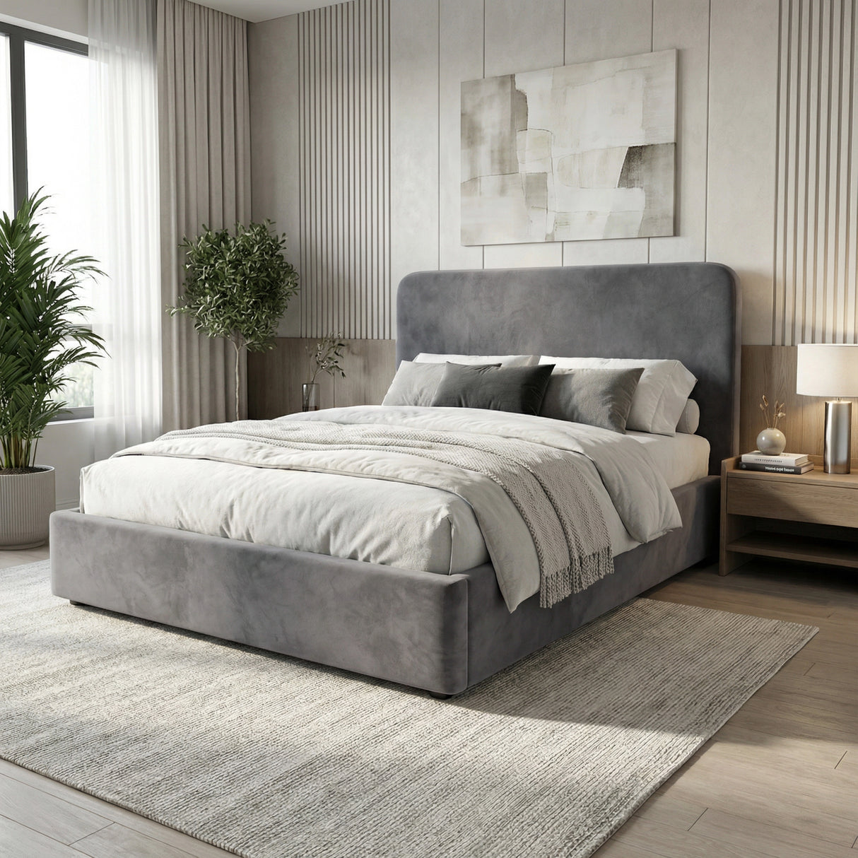 Angled room view of grey velvet double ottoman storage bed, highlighting padded headboard and frame design