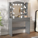 Gray vanity desk with mirror and lights in a room setting