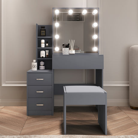 Grey dressing table with mirror, LED lights, drawers, and stool for modern bedroom decor.