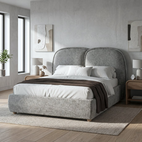 [Grey] Embracea upholstered bed frame in a minimal bedroom with oak nightstands and neutral de