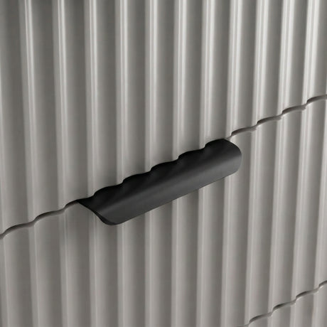 [Grey] Close detail of grey flutrina drawer front with sleek metal pull handle of the six-drawer chest