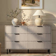 [Grey] Flutrina 6-drawer chest styled in a warm beige bedroom with vase, lamp and wall art