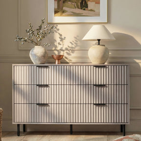 [Grey] Flutrina 6-drawer chest styled in a warm beige bedroom with vase, lamp and wall art