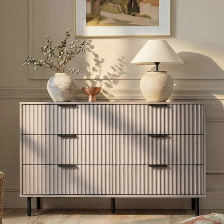 [Grey] Flutrina 6-drawer chest styled in a warm beige bedroom with vase, lamp and wall art