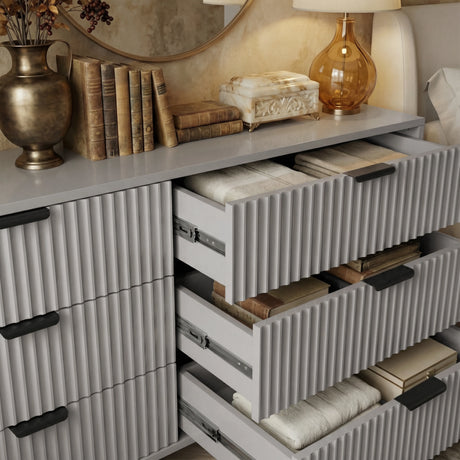 Grey bedroom drawers fully opened to reveal internal compartments and storage capacity