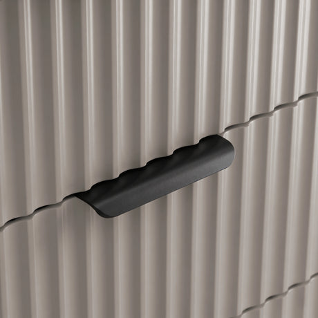 [Grey] Flutrina close-up of matte black ribbed pull handle set against the fluted drawer front