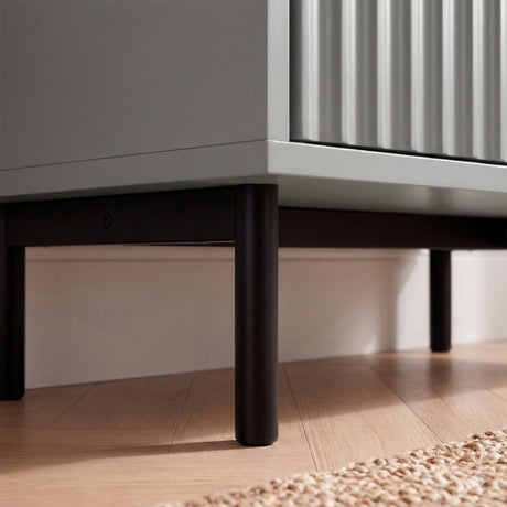 [Grey | 60cm] Flutrina close-up of matte black cylindrical legs and base frame beneath the grey cabinet on oak flooring 